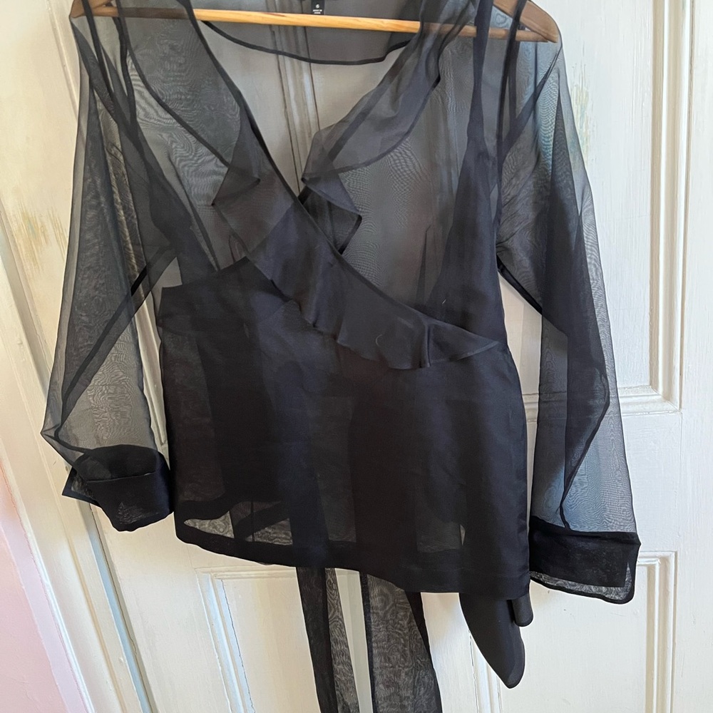 Talbots sheer black top with long sleeves and back ties.